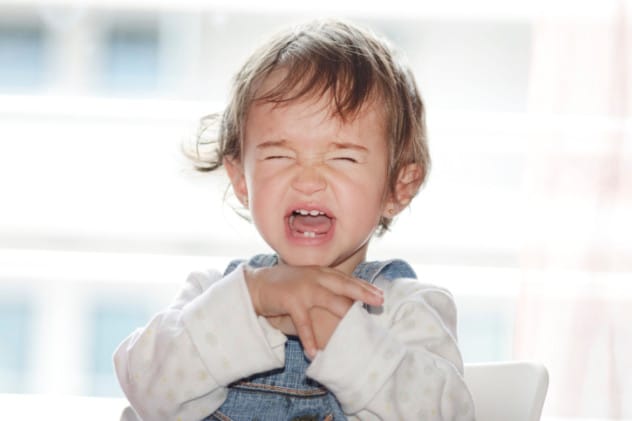 A child crying, representing the distress caused by the name Alexa