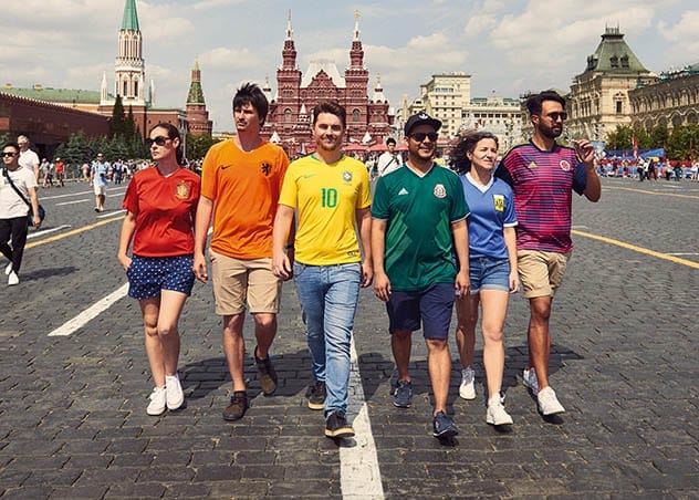 Activists wearing rainbow flag jerseys
