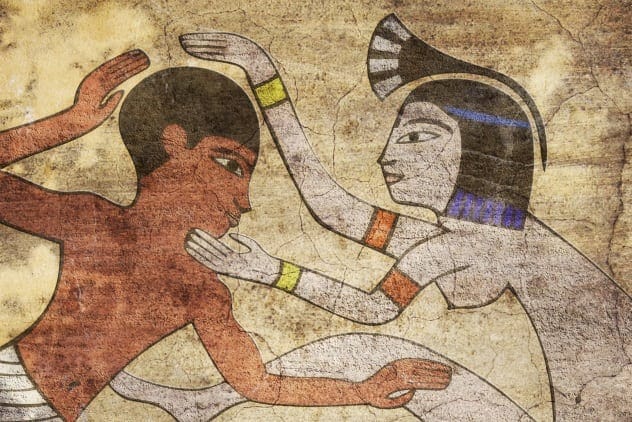 Ancient Egyptian hieroglyphs depicting figures and symbols.