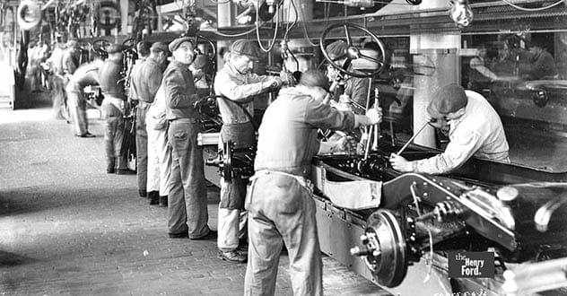 Early Ford Model T assembly line, showcasing factory production