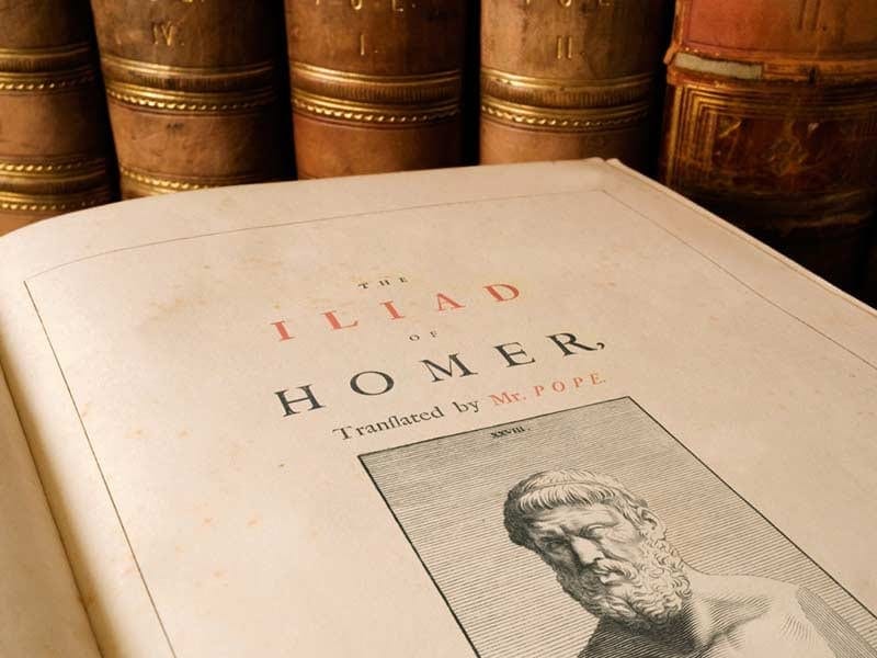 Ancient scrolls and books representing classical literature