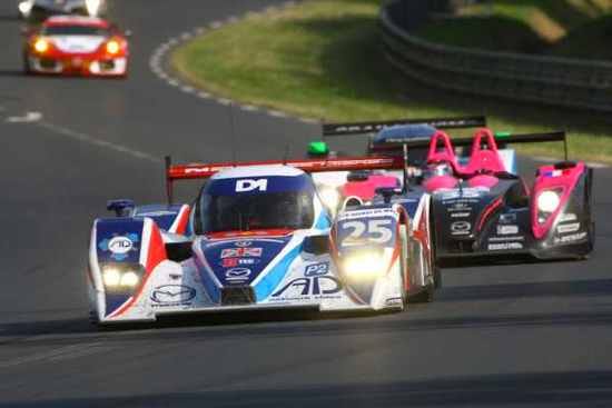 Modern Le Mans race cars in action