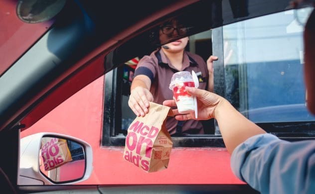 McDonald's meal in a car, representing a driver's excuse for speeding