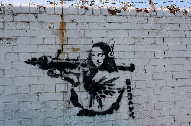 Banksy's Mona Lisa Bazooka stencil art showing Mona Lisa holding a rocket launcher.