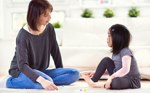 A mother lovingly looking at her child, representing the reincarnation case of Tae