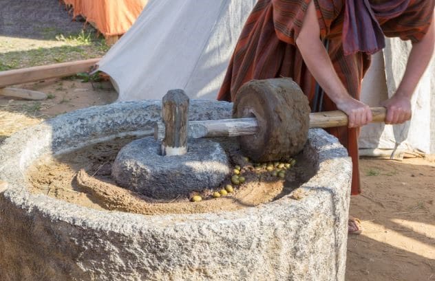 An old-fashioned olive press, symbolizing Suleyman Andary's past life memories
