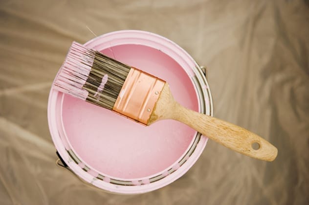 Paintbrushes with colorful spice powders, showing how spices create natural paints.