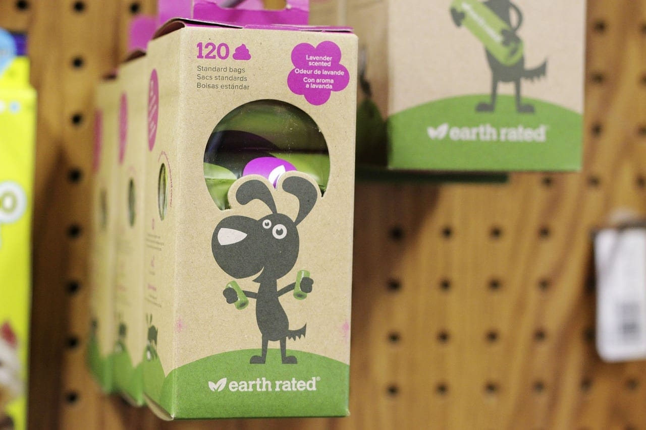 Dog with a poop bag