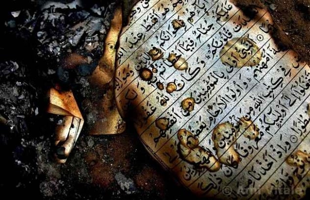 Image depicting a Quran on fire, representing burning controversies
