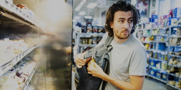Shoplifter caught on a supermarket security camera with his name visible on his shirt