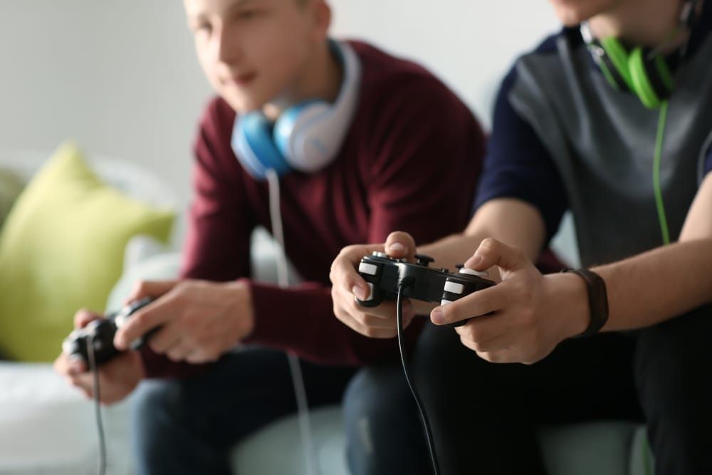 People playing video games reflecting the industry's changes