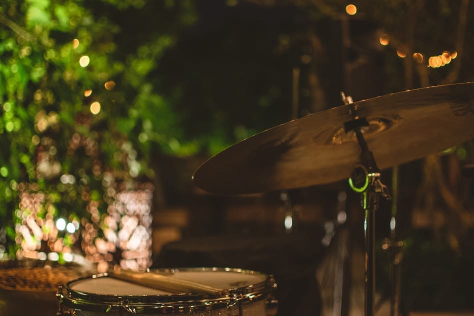 Outdoor bar with string lights, depicting a bar's solution to noise complaints.