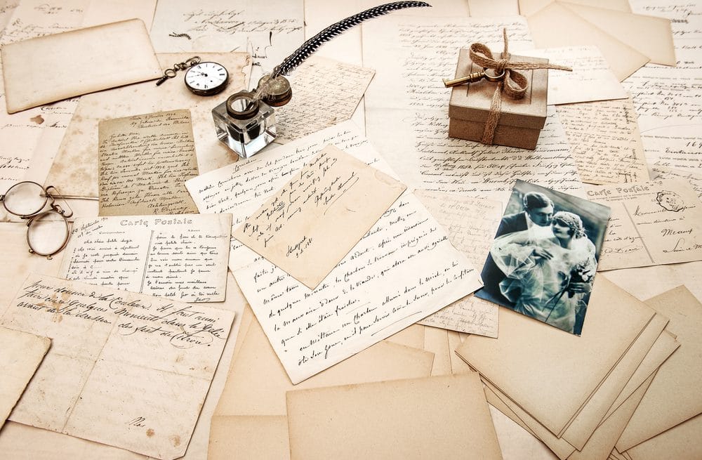 Old love letters and photos representing Walter and Laura's story