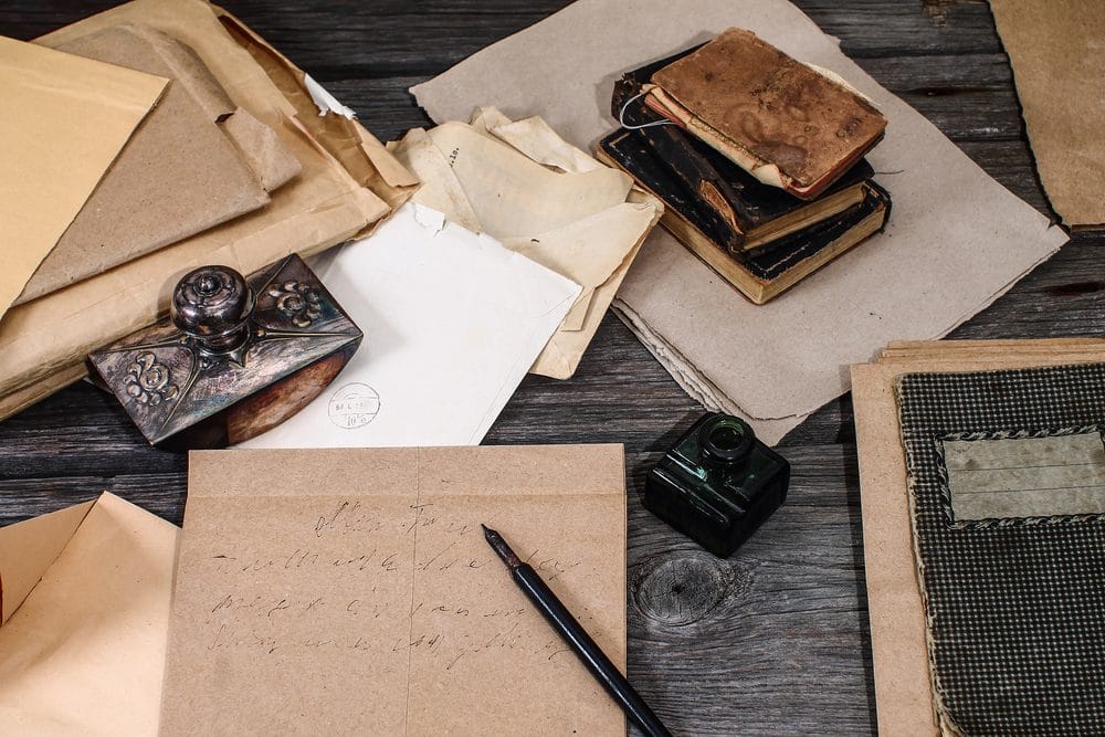 Vintage letters tied with a ribbon, symbolizing Lucy and George's correspondence