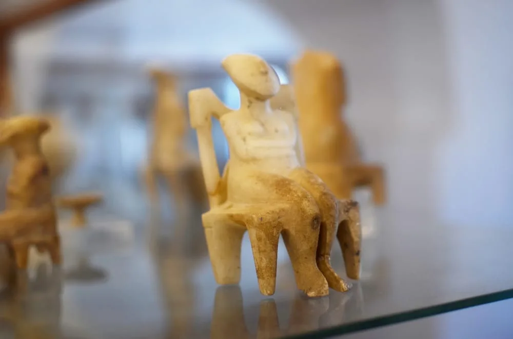 Cycladic figurine carved from white marble with elongated head