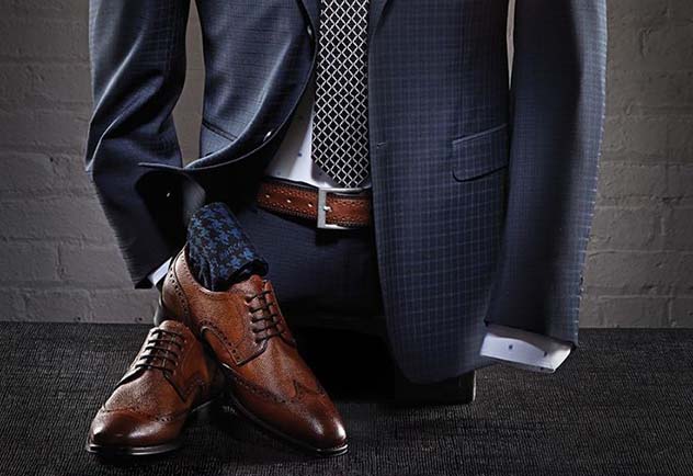 Man in a suit wearing a belt