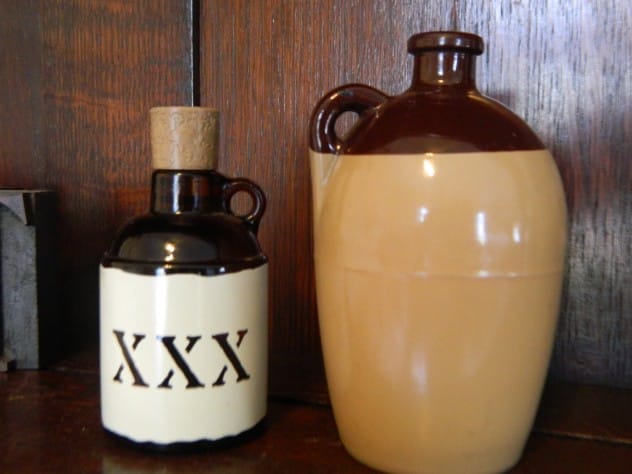 Clay jug marked with XXX, indicating triple-distilled moonshine
